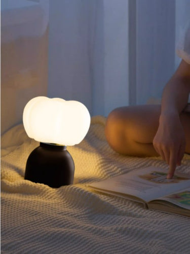 Modern Cotton Table Lamp - Unique Minimalist Design LB-ME-TD-8200 $69.00 Discover our modern table lamp with a unique wooden body and PE lampshade. Perfect for contemporary home decor, it features easy button control.