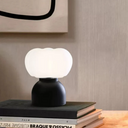 Modern Cotton Table Lamp - Unique Minimalist Design LB-ME-TD-8200 $69.00 Discover our modern table lamp with a unique wooden body and PE lampshade. Perfect for contemporary home decor, it features easy button control.