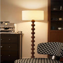 Unique Modern Gourd Floor Lamp - Mid-Century Elegance LB-QDH-LD-2009 $299.00 Discover the unique modern floor lamp crafted from walnut wood and fabric. Elevate your space with this mid-century, elegant, and cozy lighting solution.